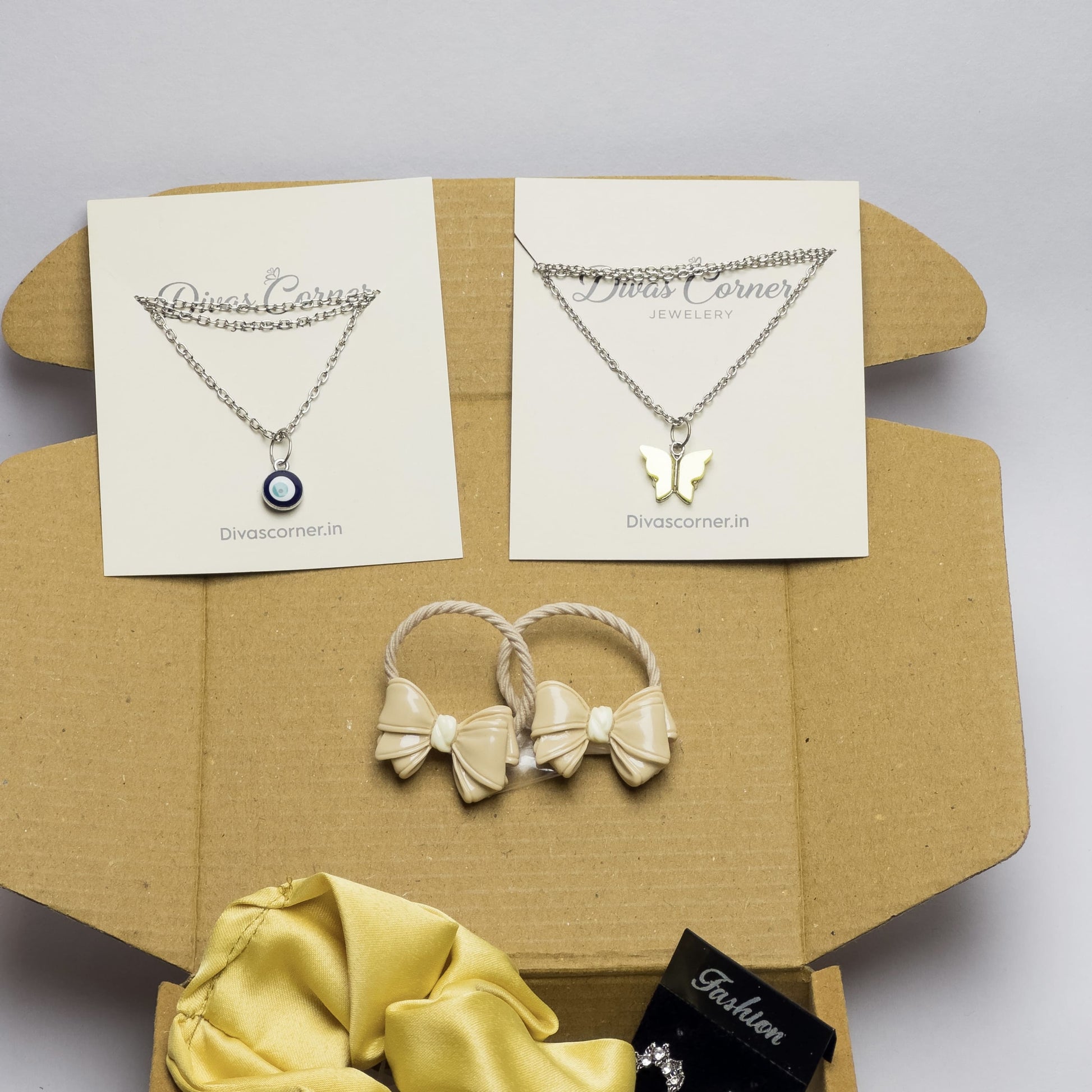 gift box for girls with jewelry, accessories, scrunchie, bracelet, and cute keychain