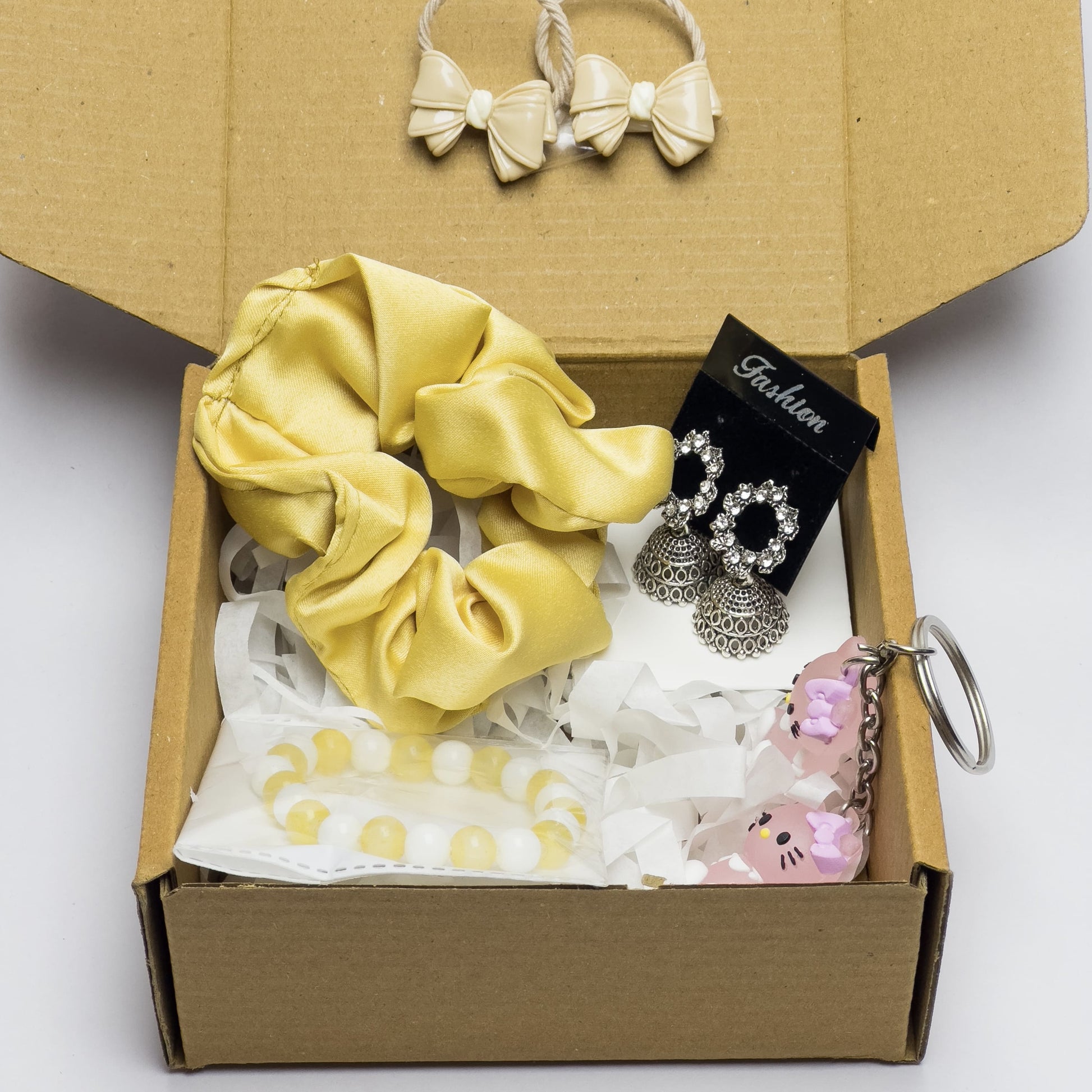 gift box for girls with jewelry, accessories, scrunchie, bracelet, and cute keychain
