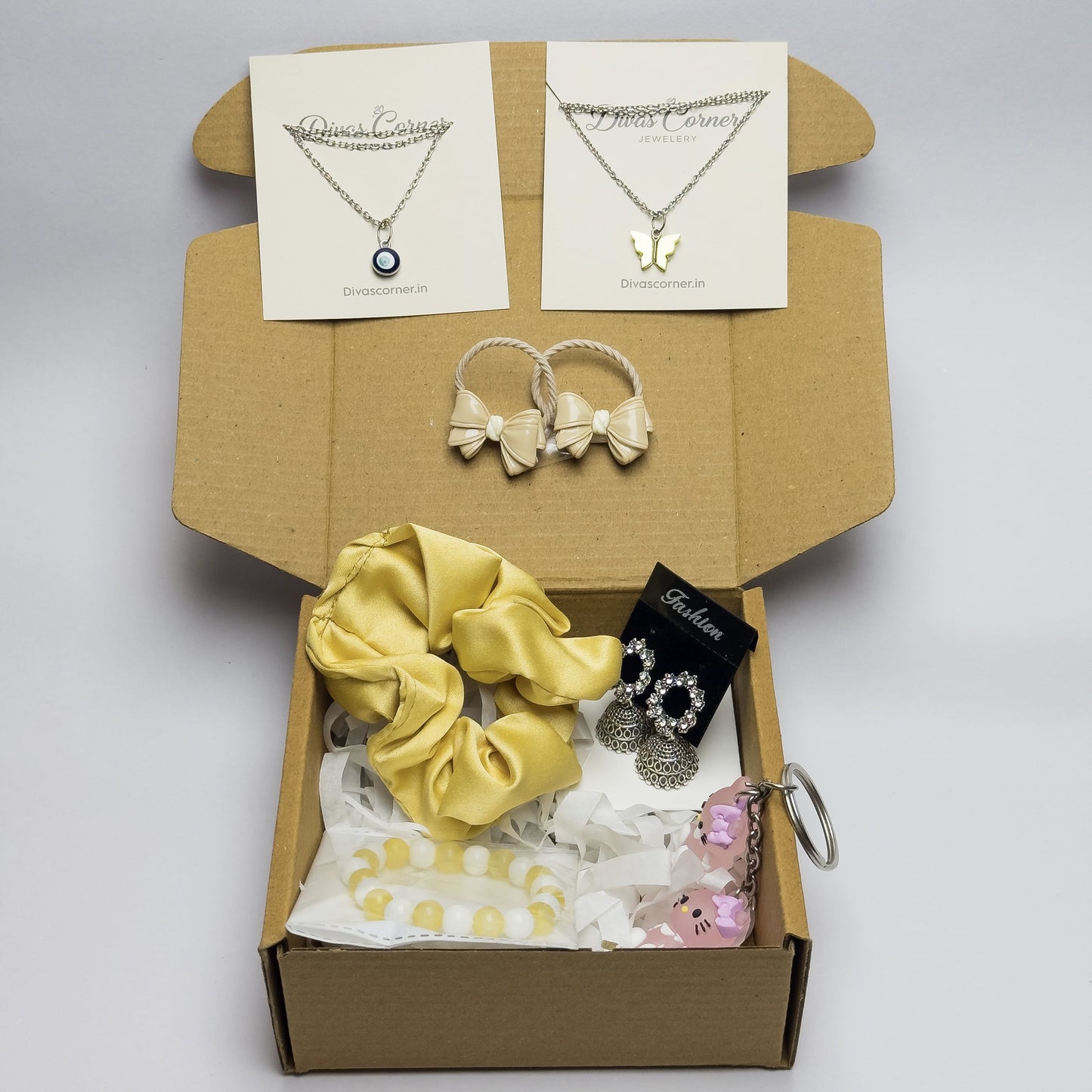 gift box for girls with jewelry, accessories, scrunchie, bracelet, and cute keychain