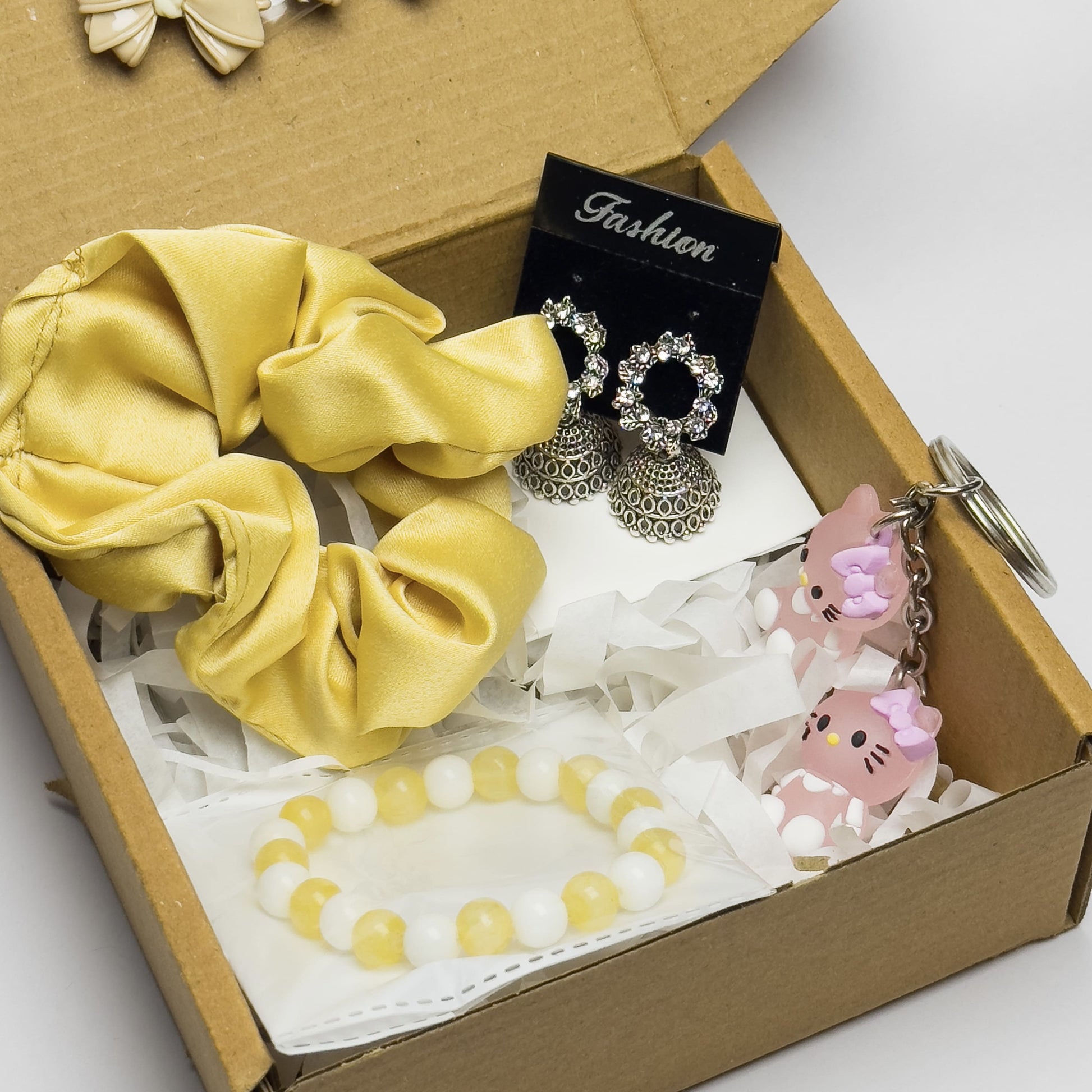 gift box for girls with jewelry, accessories, scrunchie, bracelet, and cute keychain